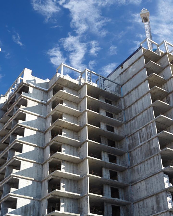 Construction of building. Beautiful sky background.